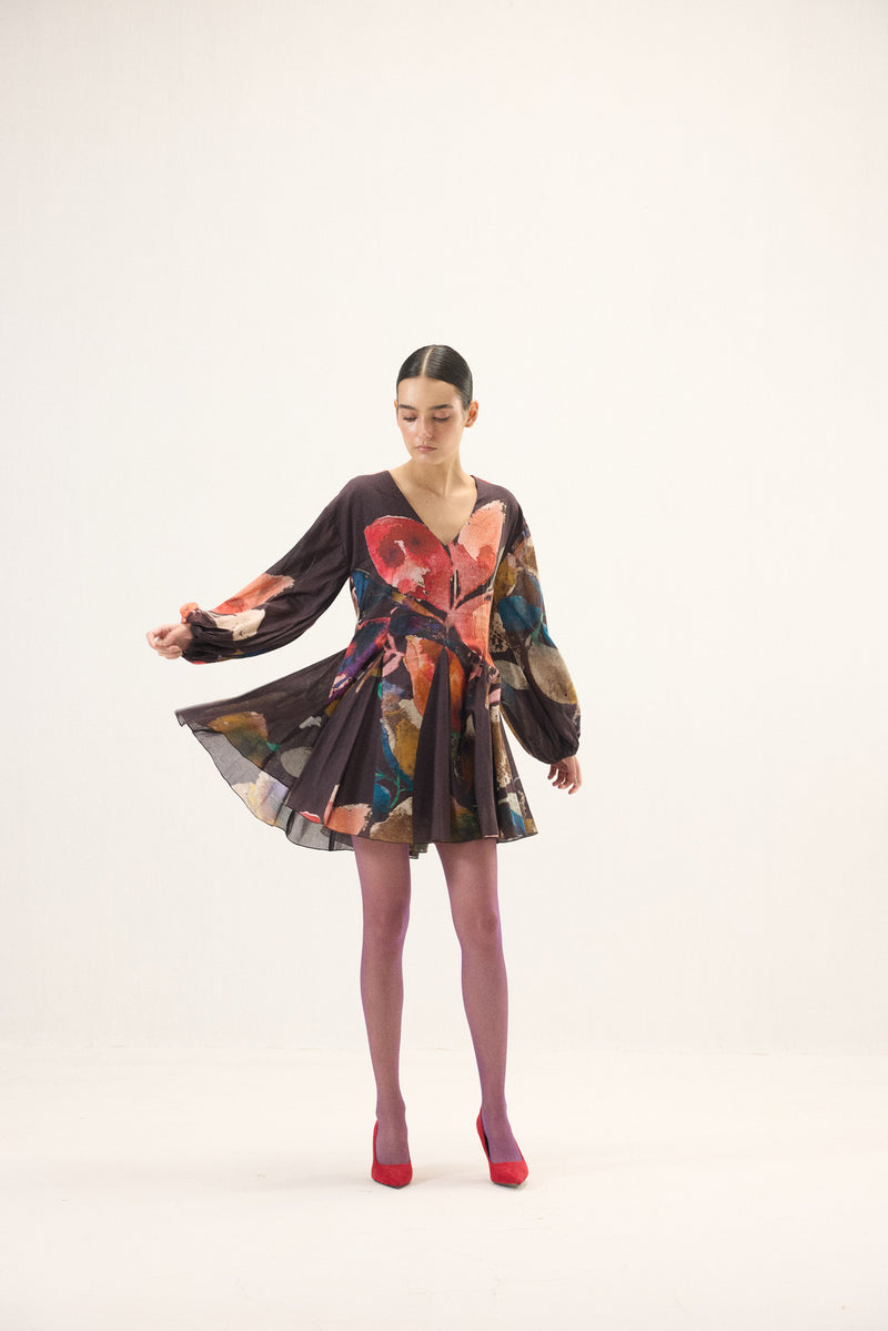 Khara Kapas Kaleido purple floral printed cotton mul dress with V neckline, puff sleeves and flared godet hem