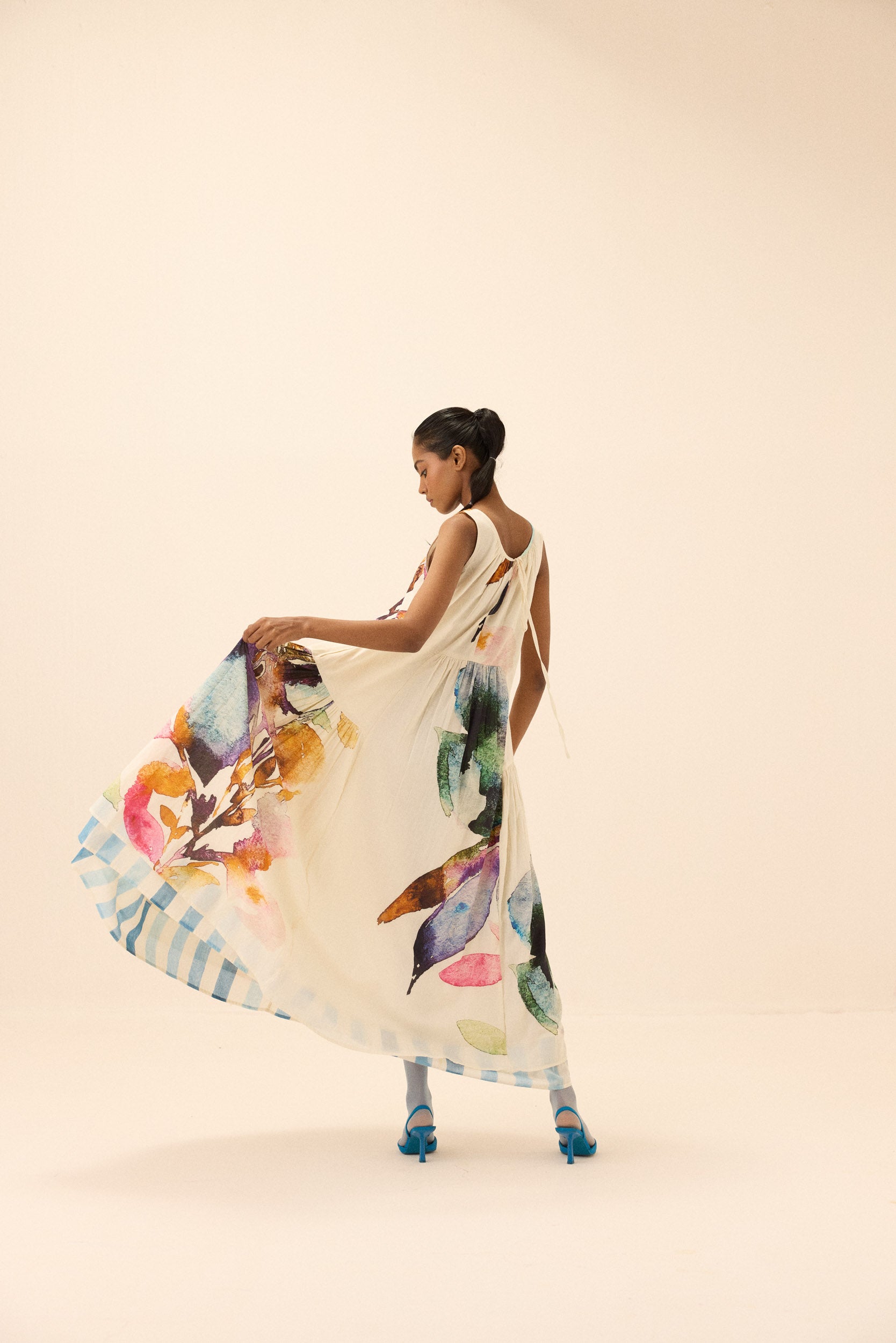 Arcadia handcrafted floral cotton dress, back view with tiered skirt